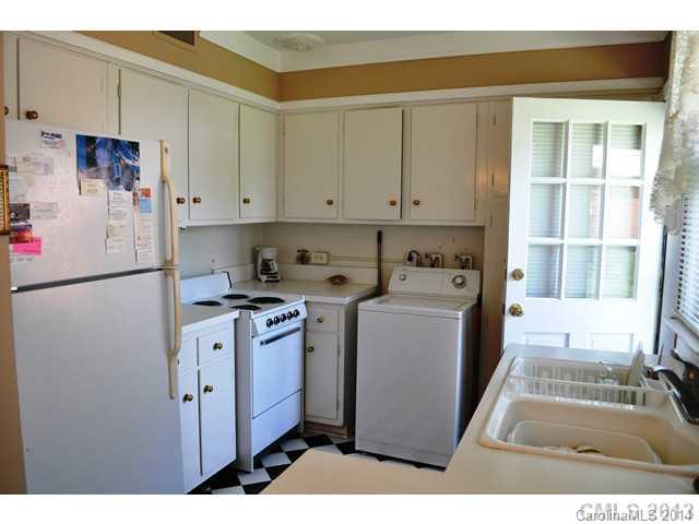 4223 Cheltenham Road, Unit 4223 Charlotte, NC 28211 - Photo 10 of 16 a utility room with cabinets washer and dryer