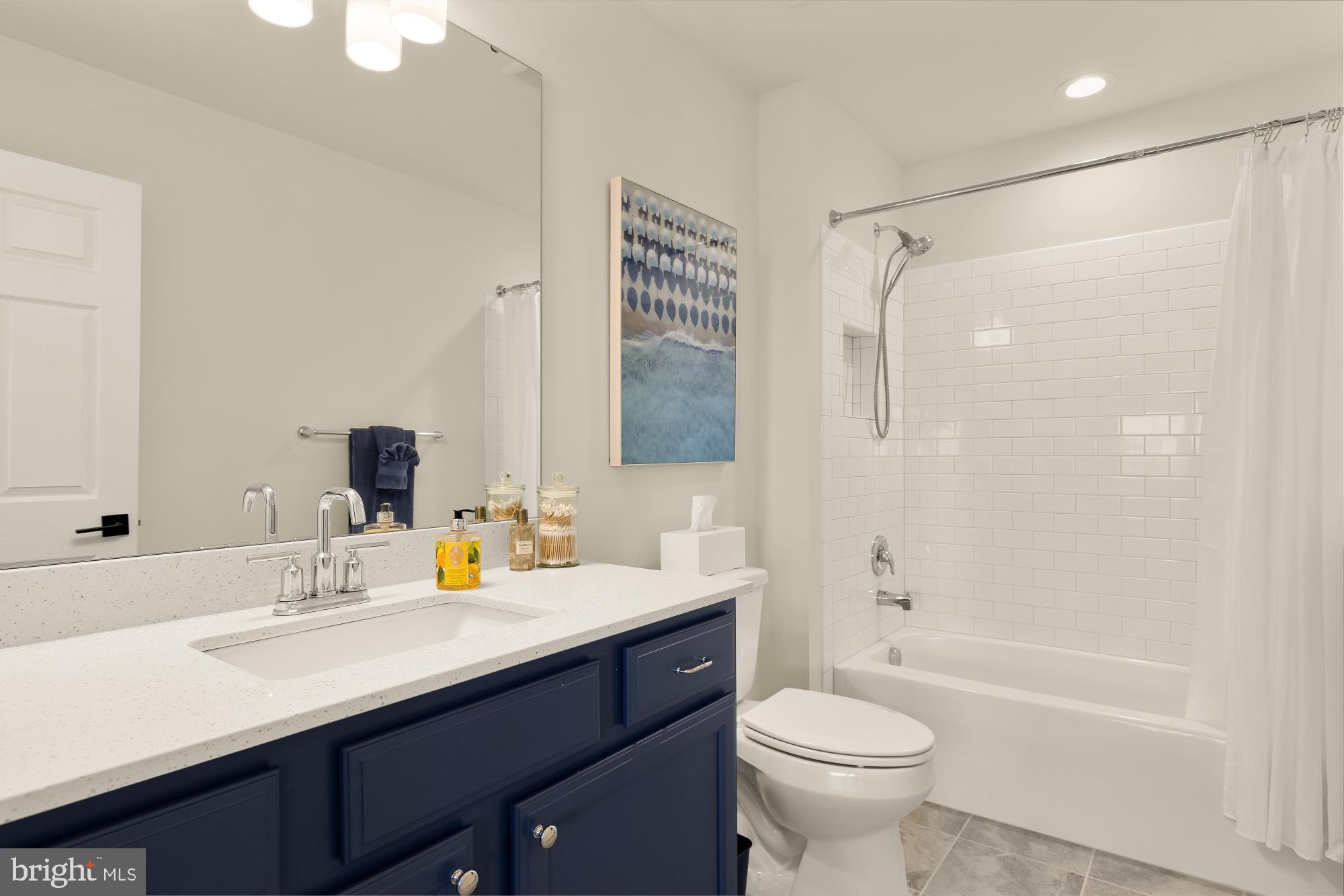 11634 Cannon Road Lewes, DE 19958 - Photo 22 of 41 a bathroom with a sink toilet tub and shower