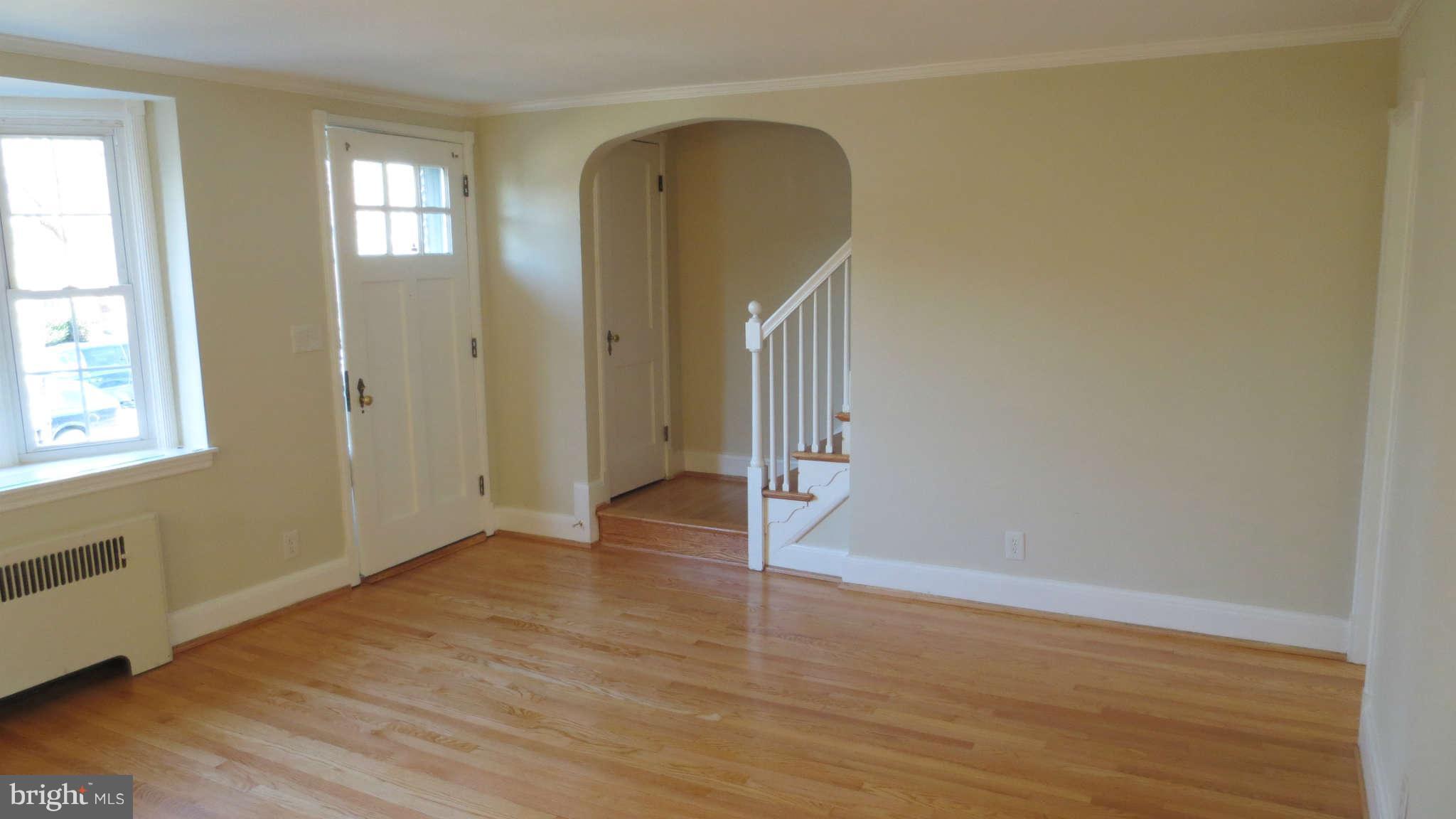 63 Murdock Road Baltimore, MD 21212 - Photo 3 of 16 a view of empty room with wooden floor and fan