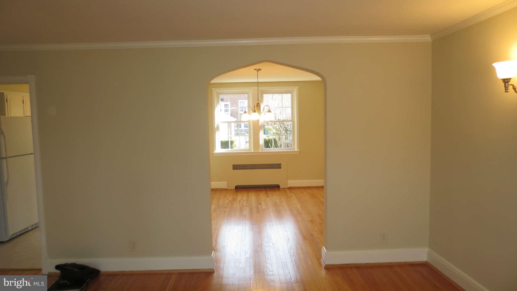 63 Murdock Road Baltimore, MD 21212 - Photo 9 of 16 a view of a livingroom with wooden floor and a window