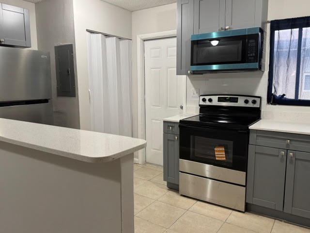 322 Southwest 2nd Street, Unit 3 Pompano Beach, FL 33060 - Photo 2 of 9 Door from kitchen to exterior