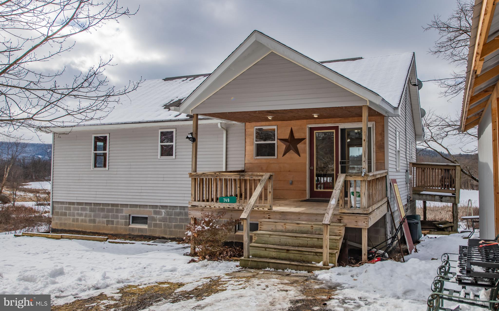749 Farrandsville Road Lock Haven, PA 17745 - Photo 1 of 25 a front view of a house with garden