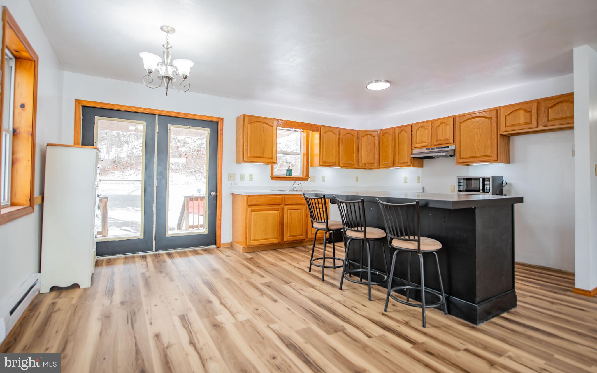 749 Farrandsville Road Lock Haven, PA 17745 - Photo 2 of 25 a living room with a table chairs and entryway with wooden floor