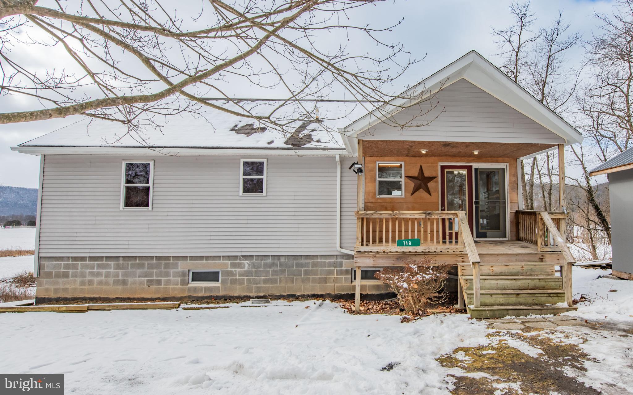 749 Farrandsville Road Lock Haven, PA 17745 - Photo 24 of 25 a front view of a house with a yard and garage