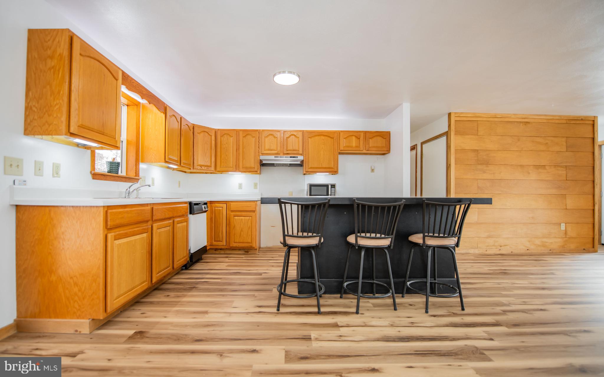 749 Farrandsville Road Lock Haven, PA 17745 - Photo 3 of 25 a kitchen with granite countertop a stove a sink and a refrigerator