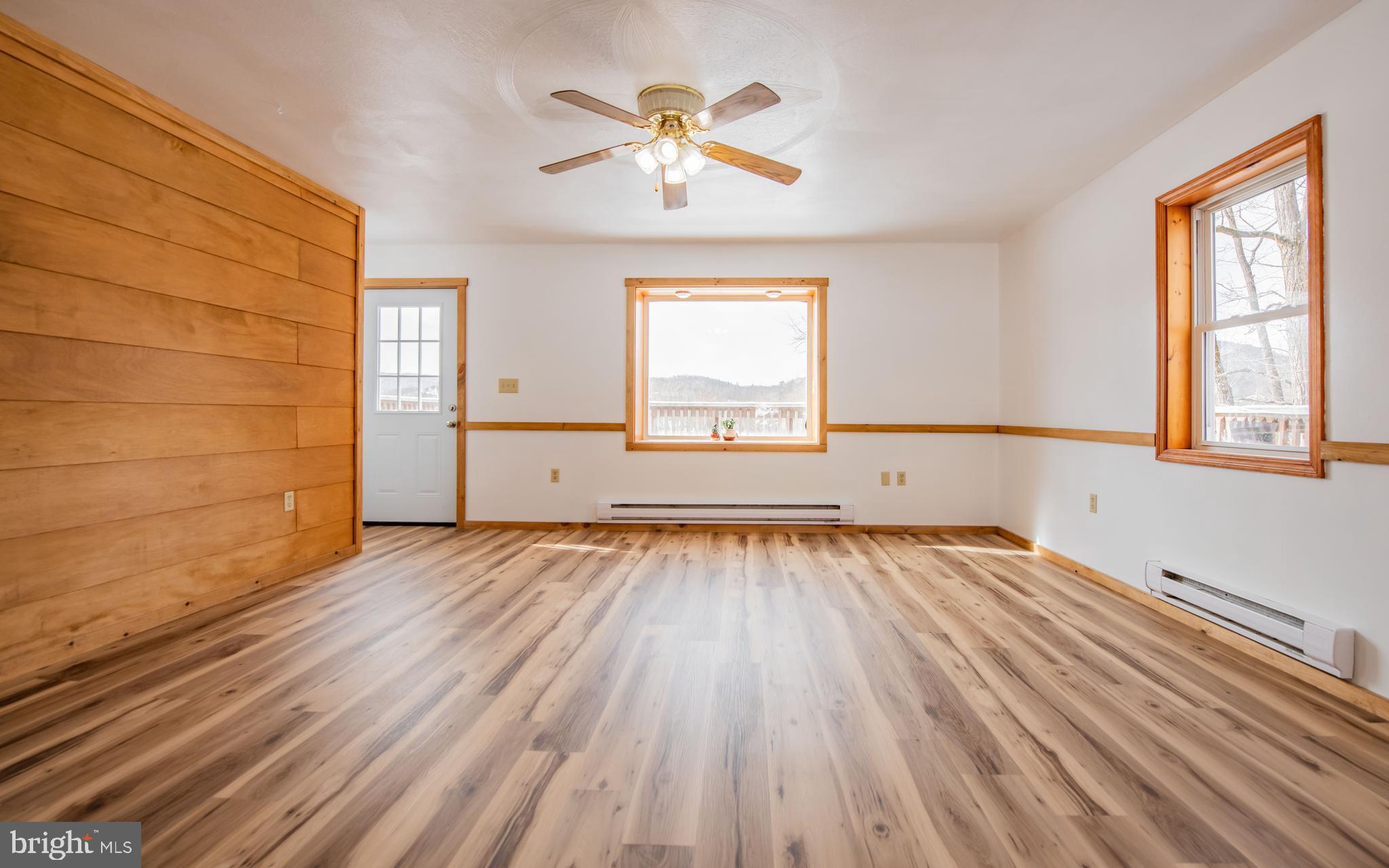 749 Farrandsville Road Lock Haven, PA 17745 - Photo 8 of 25 wooden floor in an empty room with a window