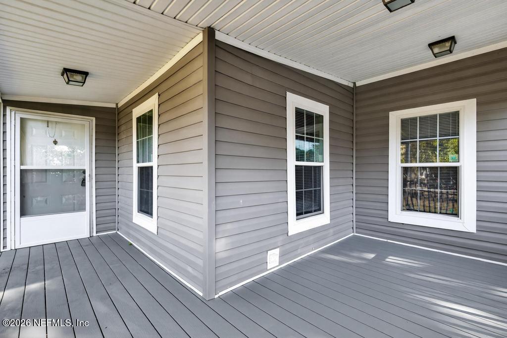 85146 Eady Lane Yulee, FL 32097 - Photo 11 of 74 a view of a house with a deck