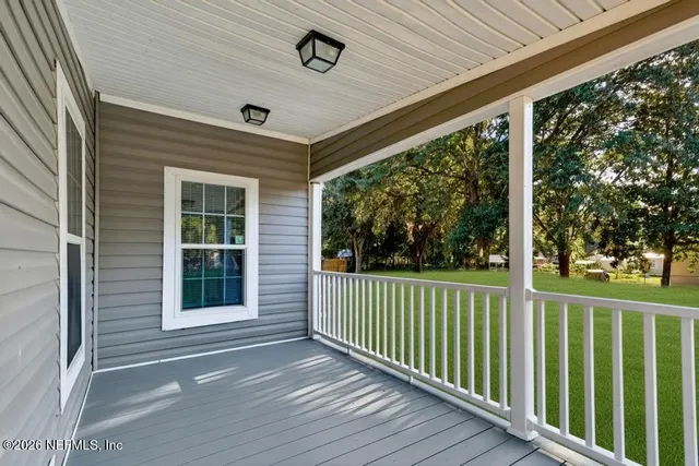 a room with furniture potted plant and a window