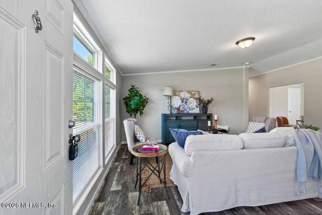 85146 Eady Lane Yulee, FL 32097 - Photo 14 of 74 a living room with furniture and a window