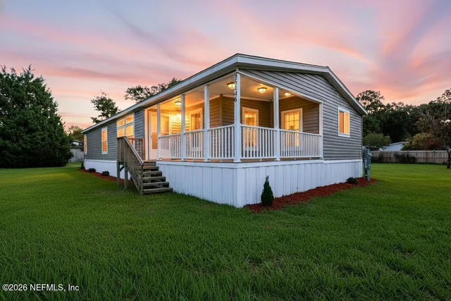 a backyard of a house with lots of green space
