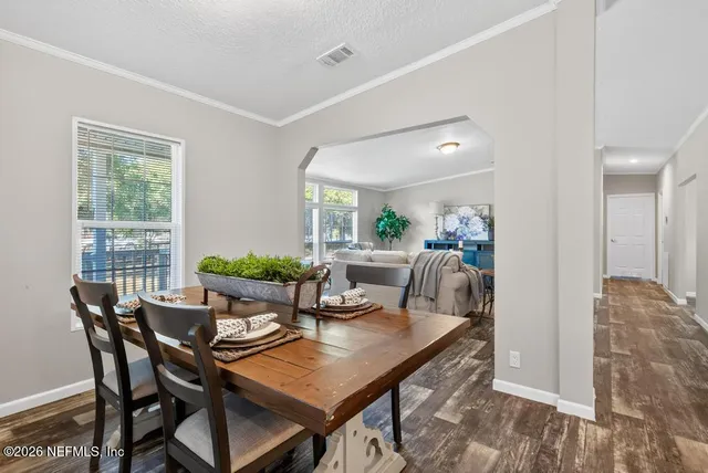 a kitchen with stainless steel appliances granite countertop a sink refrigerator and microwave