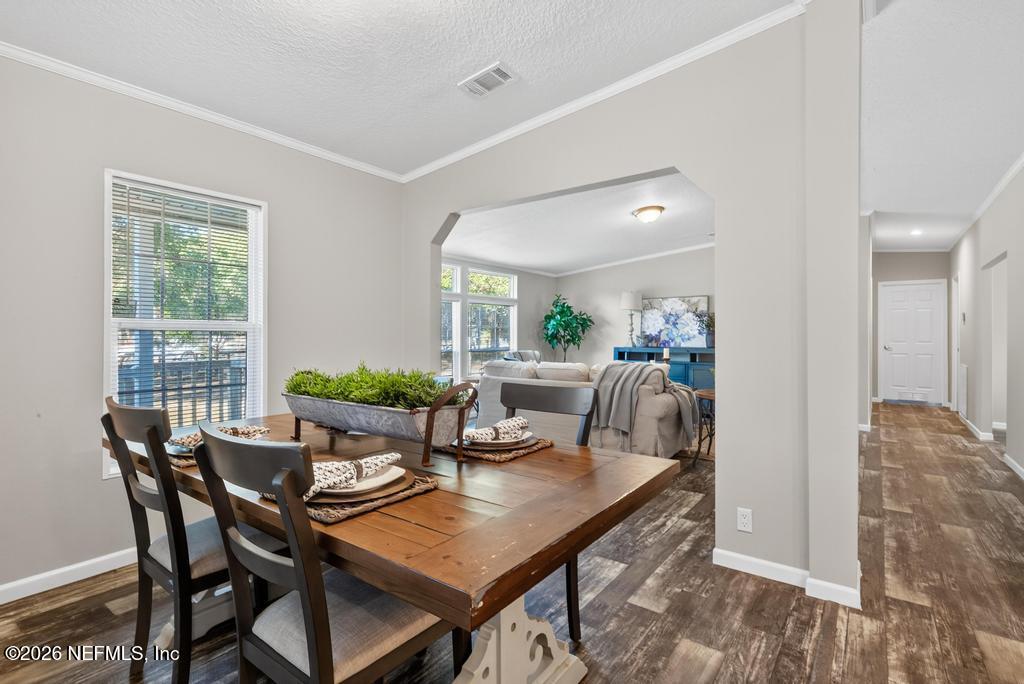85146 Eady Lane Yulee, FL 32097 - Photo 22 of 74 a view of a dining room with furniture and window