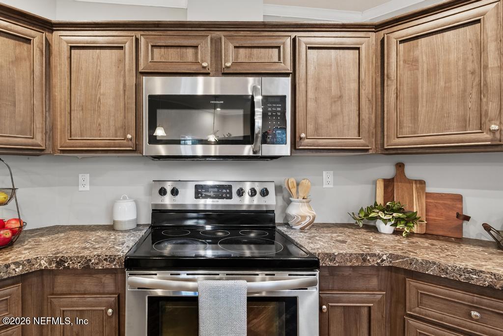 85146 Eady Lane Yulee, FL 32097 - Photo 25 of 74 a stove top oven sitting inside of a kitchen