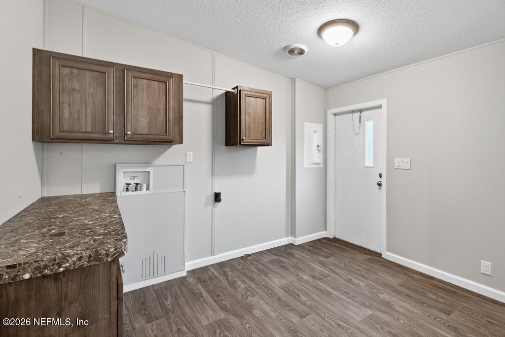 85146 Eady Lane Yulee, FL 32097 - Photo 31 of 74 a view of kitchen with wooden floor and electronic appliances