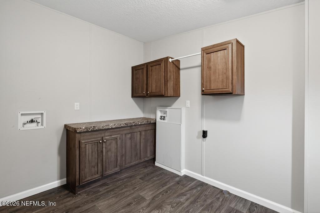 85146 Eady Lane Yulee, FL 32097 - Photo 32 of 74 a kitchen with stainless steel appliances granite countertop a sink stove and microwave