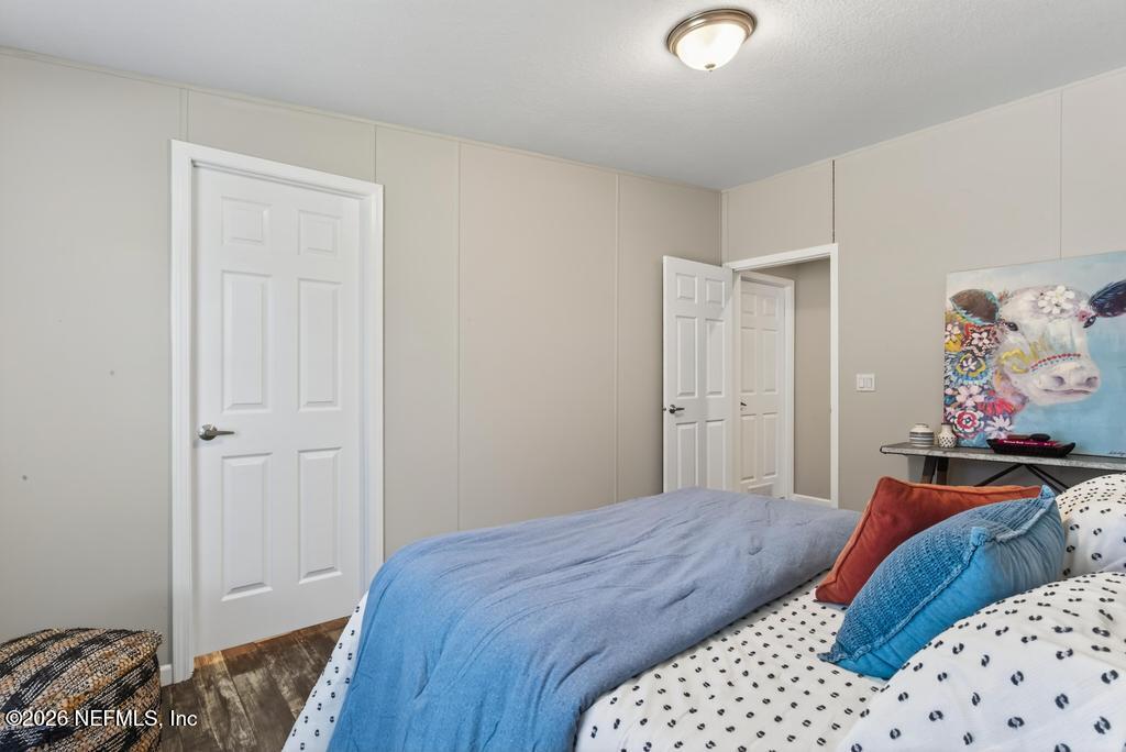 85146 Eady Lane Yulee, FL 32097 - Photo 39 of 74 a bedroom with a bed and a view of bedroom