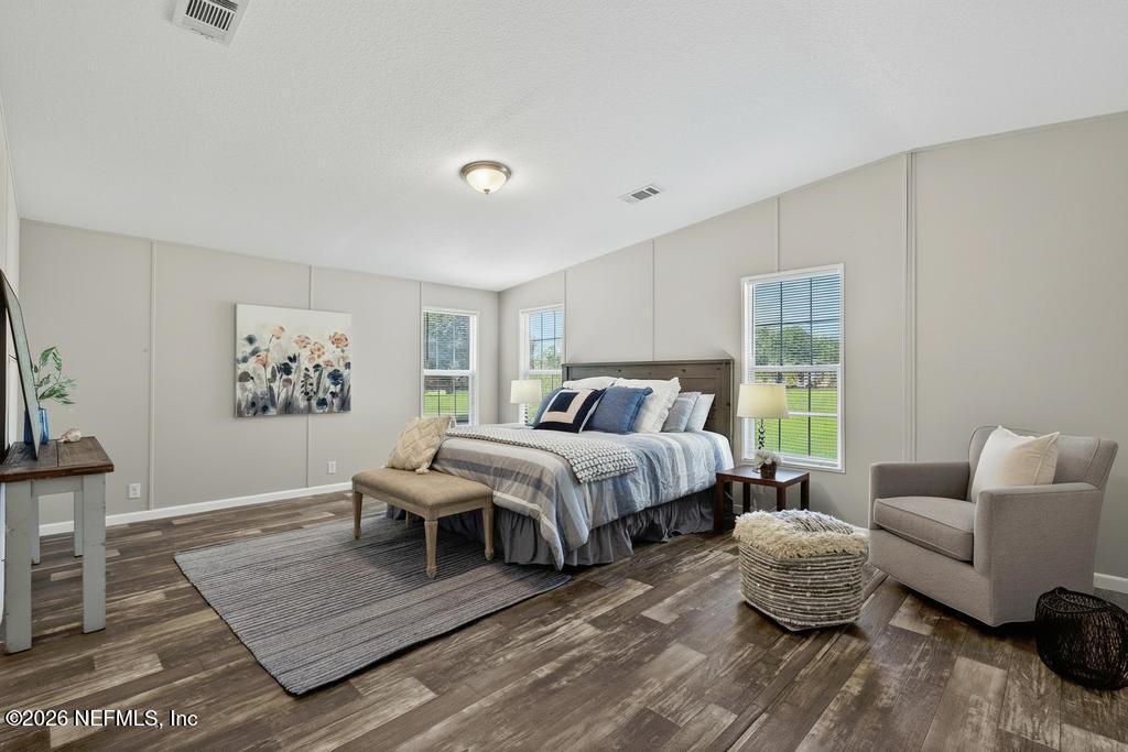 85146 Eady Lane Yulee, FL 32097 - Photo 40 of 74 a bedroom with a bed and a couch