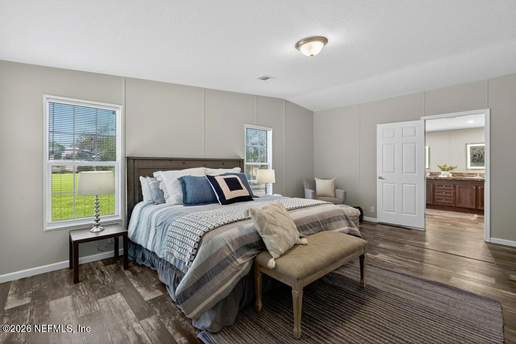 85146 Eady Lane Yulee, FL 32097 - Photo 43 of 74 a bedroom with a bed and a window