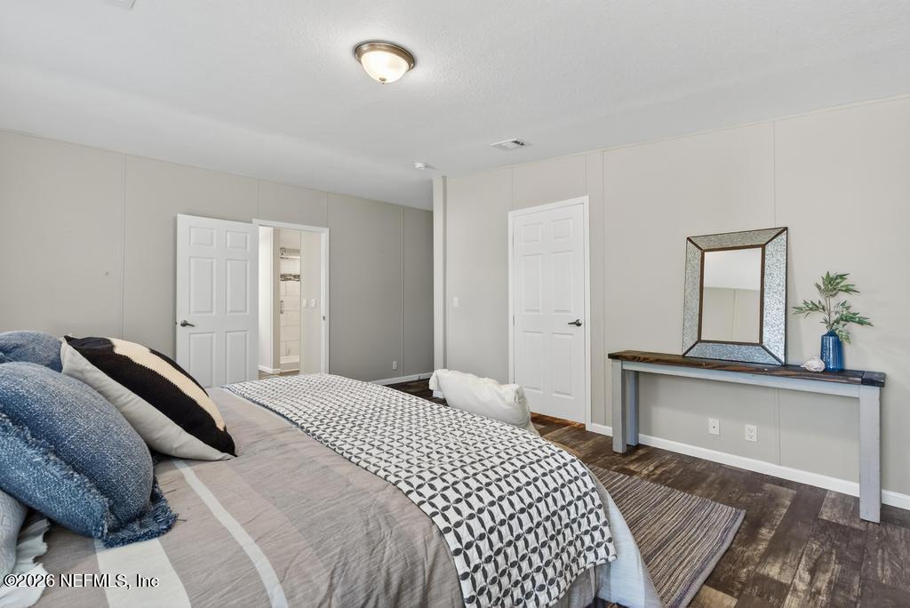 85146 Eady Lane Yulee, FL 32097 - Photo 44 of 74 a bedroom with a bed and a couch