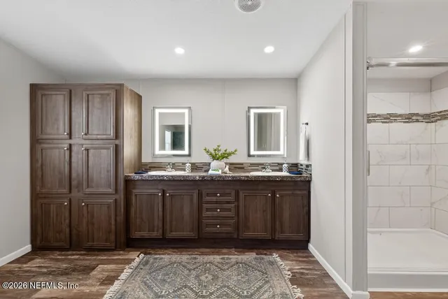 a view of dirt yard with a large tree