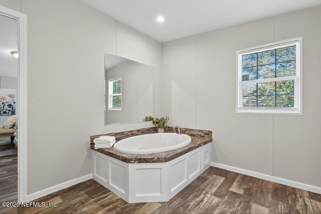 85146 Eady Lane Yulee, FL 32097 - Photo 47 of 74 a bathroom with a sink and a mirror