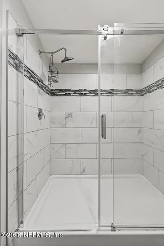 a view of a big house with a big yard and large trees