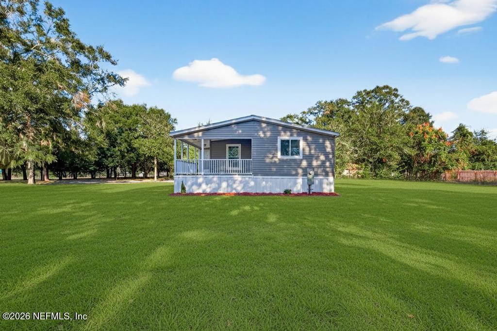 85146 Eady Lane Yulee, FL 32097 - Photo 53 of 74 a front view of a house with a yard
