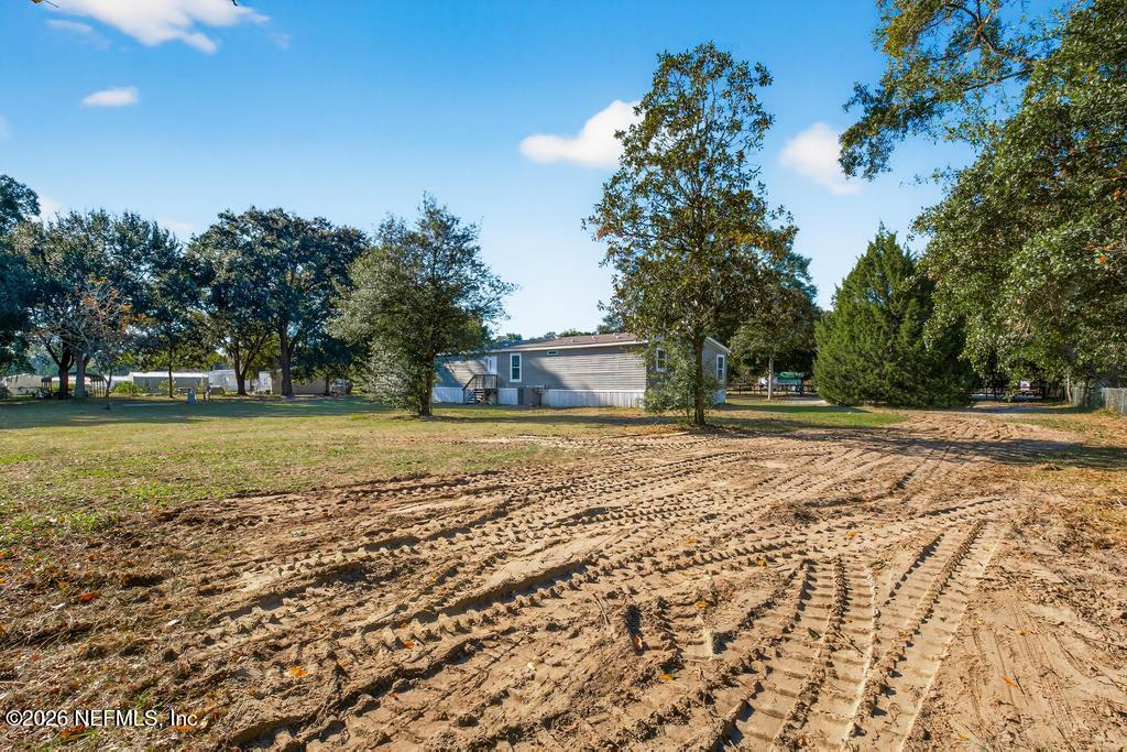 85146 Eady Lane Yulee, FL 32097 - Photo 66 of 74 a view of outdoor space with deck and yard