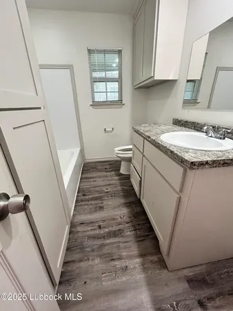 a bathroom with sink and mirror