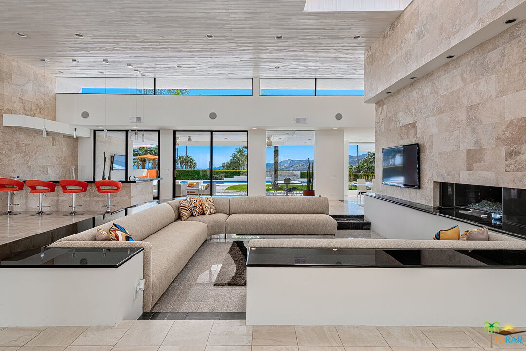 700 West Stevens Road Palm Springs, CA 92262 - Photo 11 of 54 a living room with furniture and a fireplace