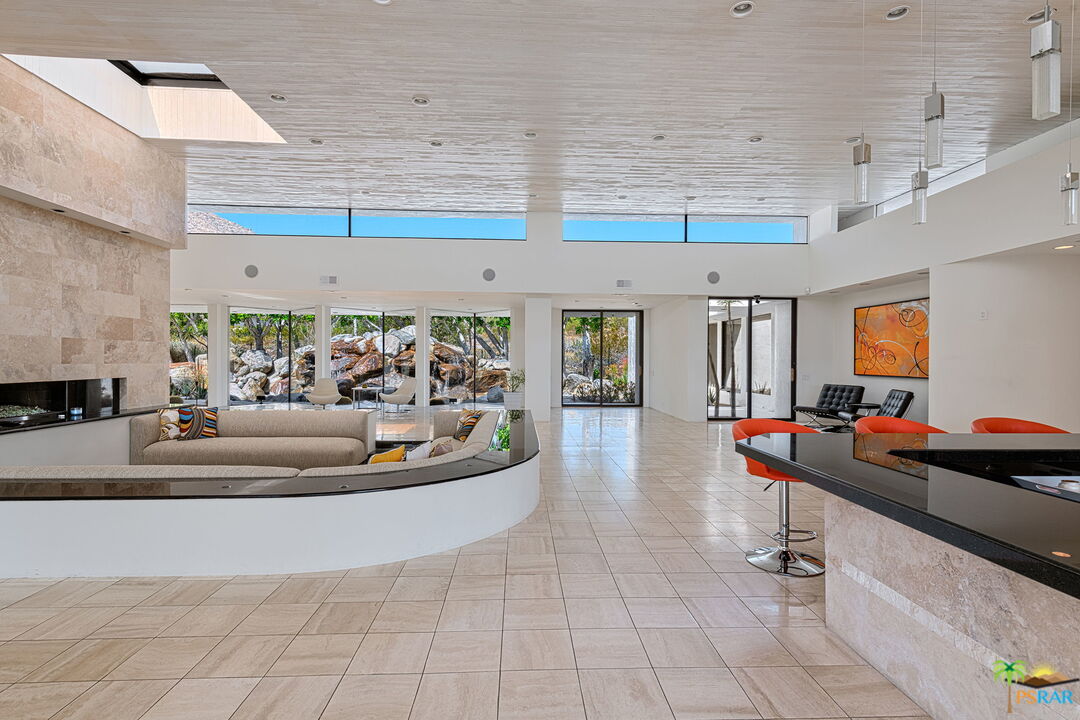 700 West Stevens Road Palm Springs, CA 92262 - Photo 12 of 54 a living room with furniture and a flat screen tv