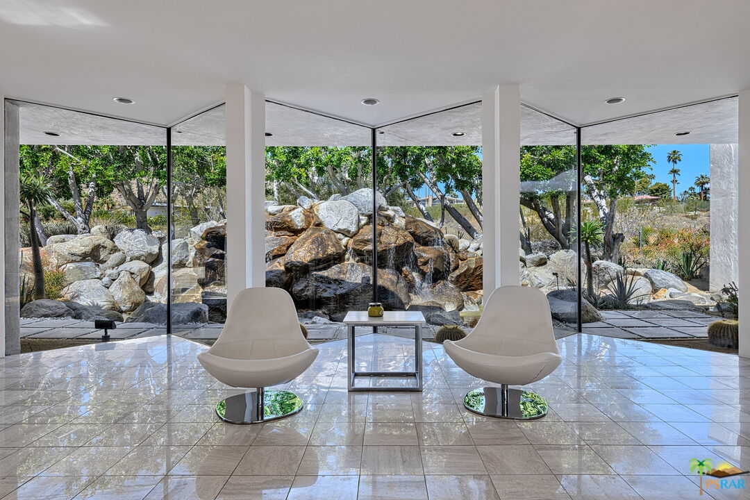 700 West Stevens Road Palm Springs, CA 92262 - Photo 14 of 54 a living room with patio furniture and a potted plant