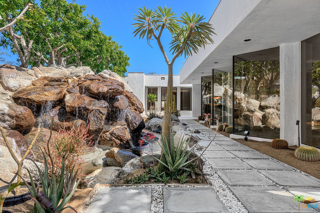 700 West Stevens Road Palm Springs, CA 92262 - Photo 15 of 54 a potted plant sitting in front of a house