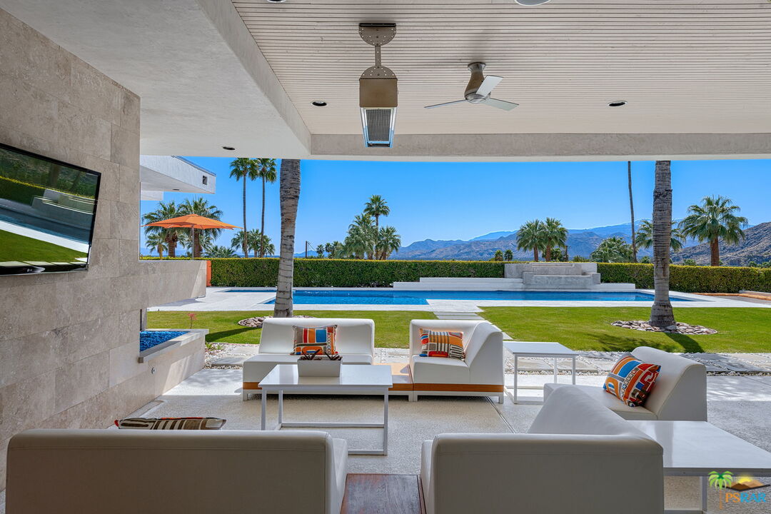 700 West Stevens Road Palm Springs, CA 92262 - Photo 24 of 54 a view of swimming pool with outdoor seating