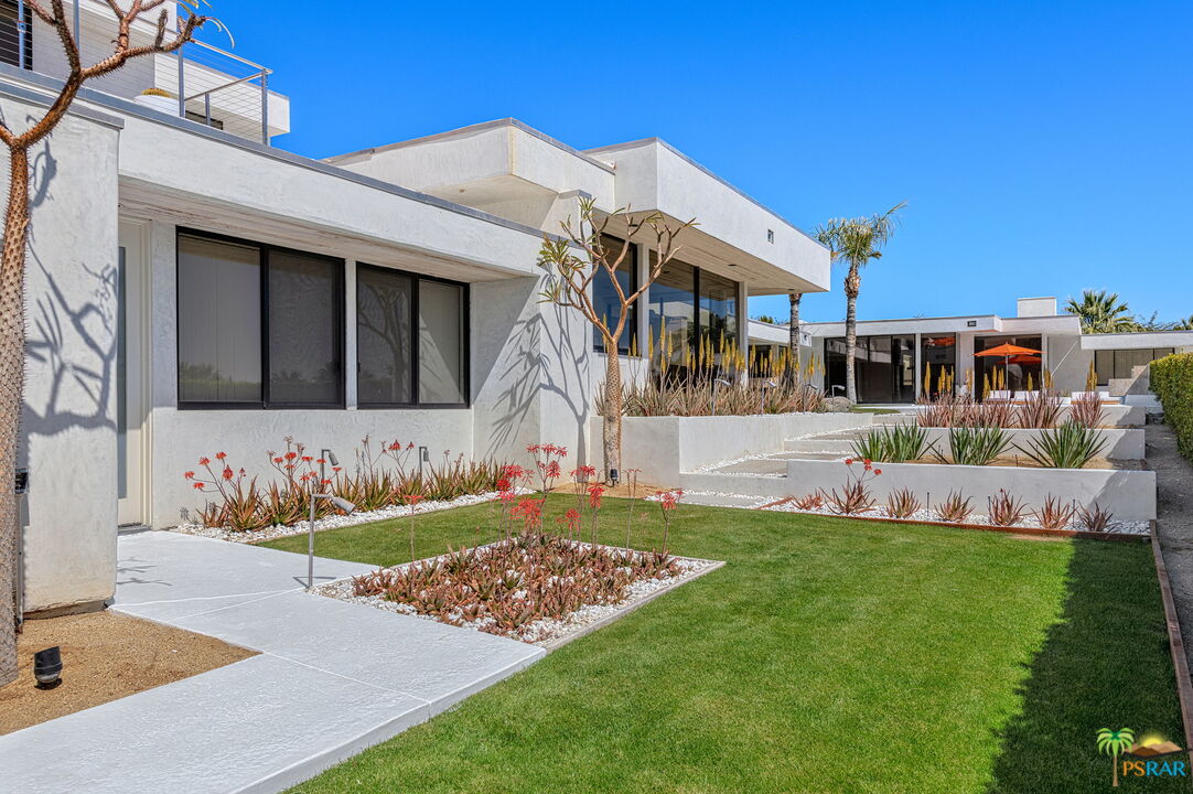 700 West Stevens Road Palm Springs, CA 92262 - Photo 30 of 54 a view of a house with a swimming pool