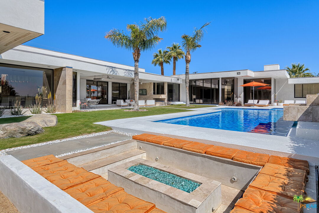 700 West Stevens Road Palm Springs, CA 92262 - Photo 32 of 54 a view of a house with swimming pool and sitting area