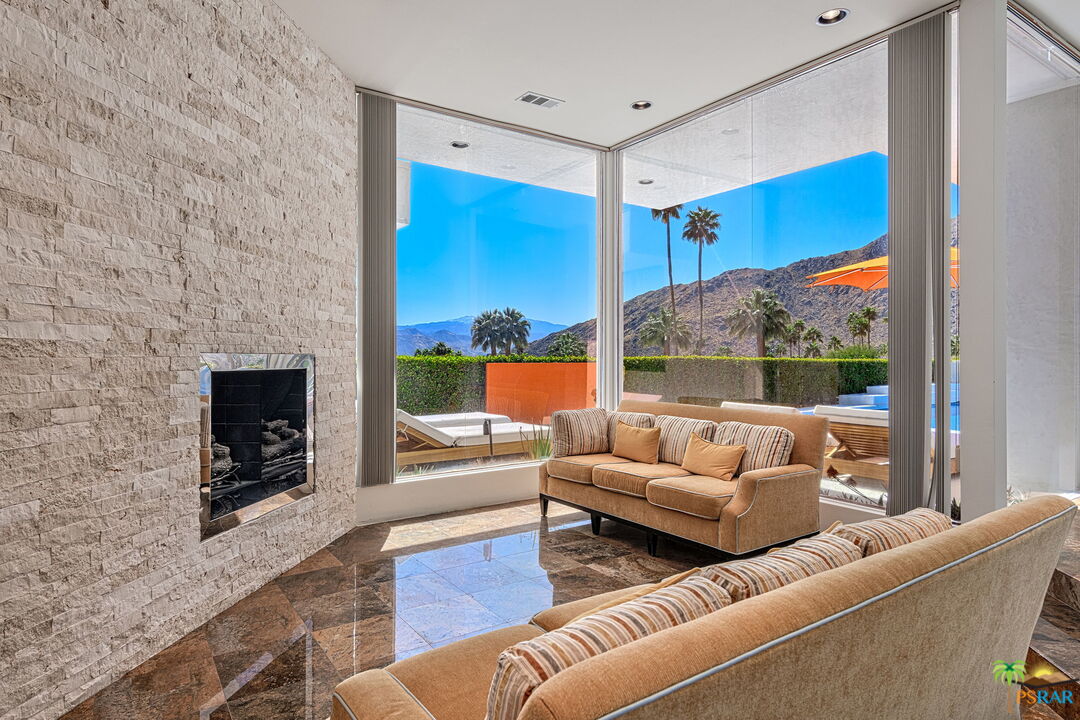 700 West Stevens Road Palm Springs, CA 92262 - Photo 34 of 54 a living room with furniture and a fireplace