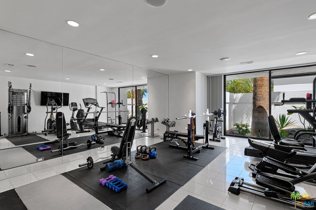 700 West Stevens Road Palm Springs, CA 92262 - Photo 37 of 54 a room with gym equipment and a large window