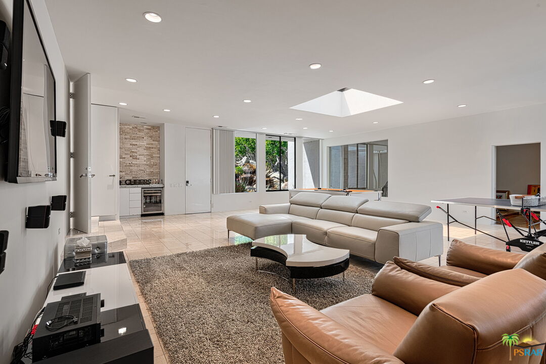 700 West Stevens Road Palm Springs, CA 92262 - Photo 38 of 54 a living room with furniture and a flat screen tv