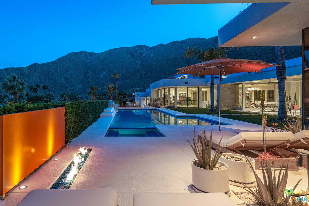700 West Stevens Road Palm Springs, CA 92262 - Photo 48 of 54 a view of swimming pool with a table under an umbrella
