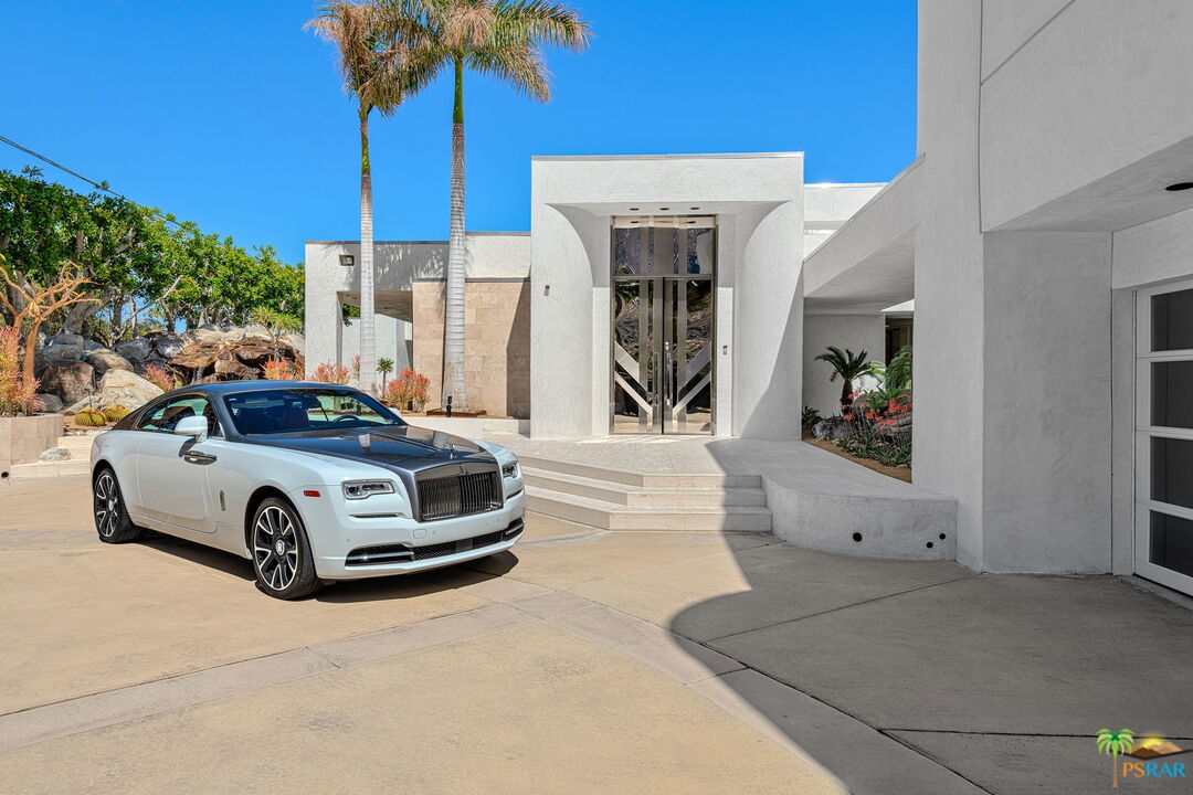 700 West Stevens Road Palm Springs, CA 92262 - Photo 6 of 54 a car parked in front of a building