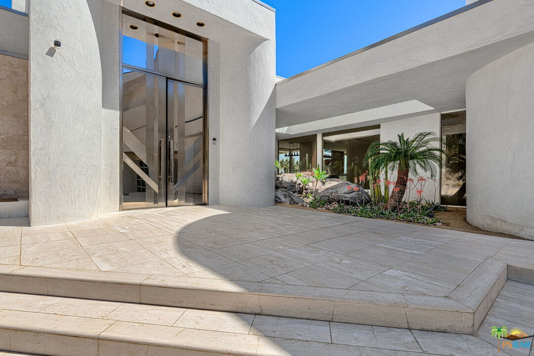 700 West Stevens Road Palm Springs, CA 92262 - Photo 7 of 54 a bedroom with a bed and a potted plant