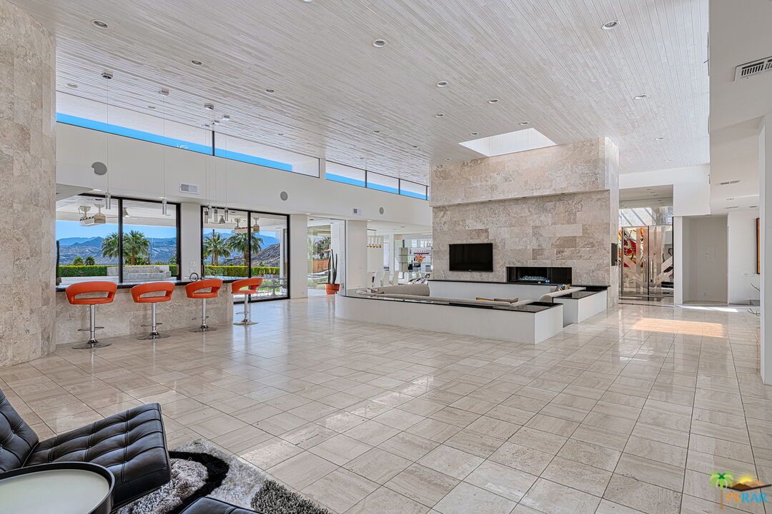 700 West Stevens Road Palm Springs, CA 92262 - Photo 10 of 54 a living room with furniture and a table