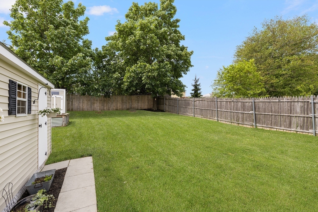 69 Denver Street Fall River, MA 02721 - Photo 6 of 35 a view of a backyard with a garden