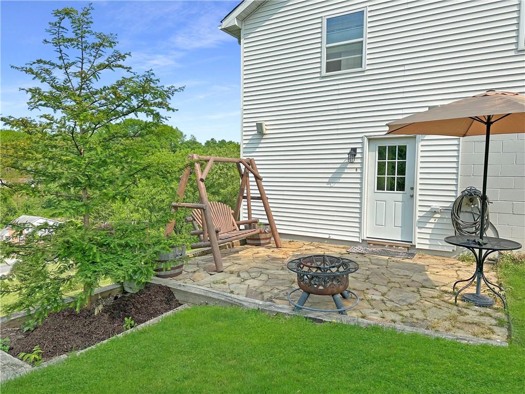 40 Coppola Road Cecil, PA 15321 - Photo 8 of 36 a view of a chair and table in backyard of the house