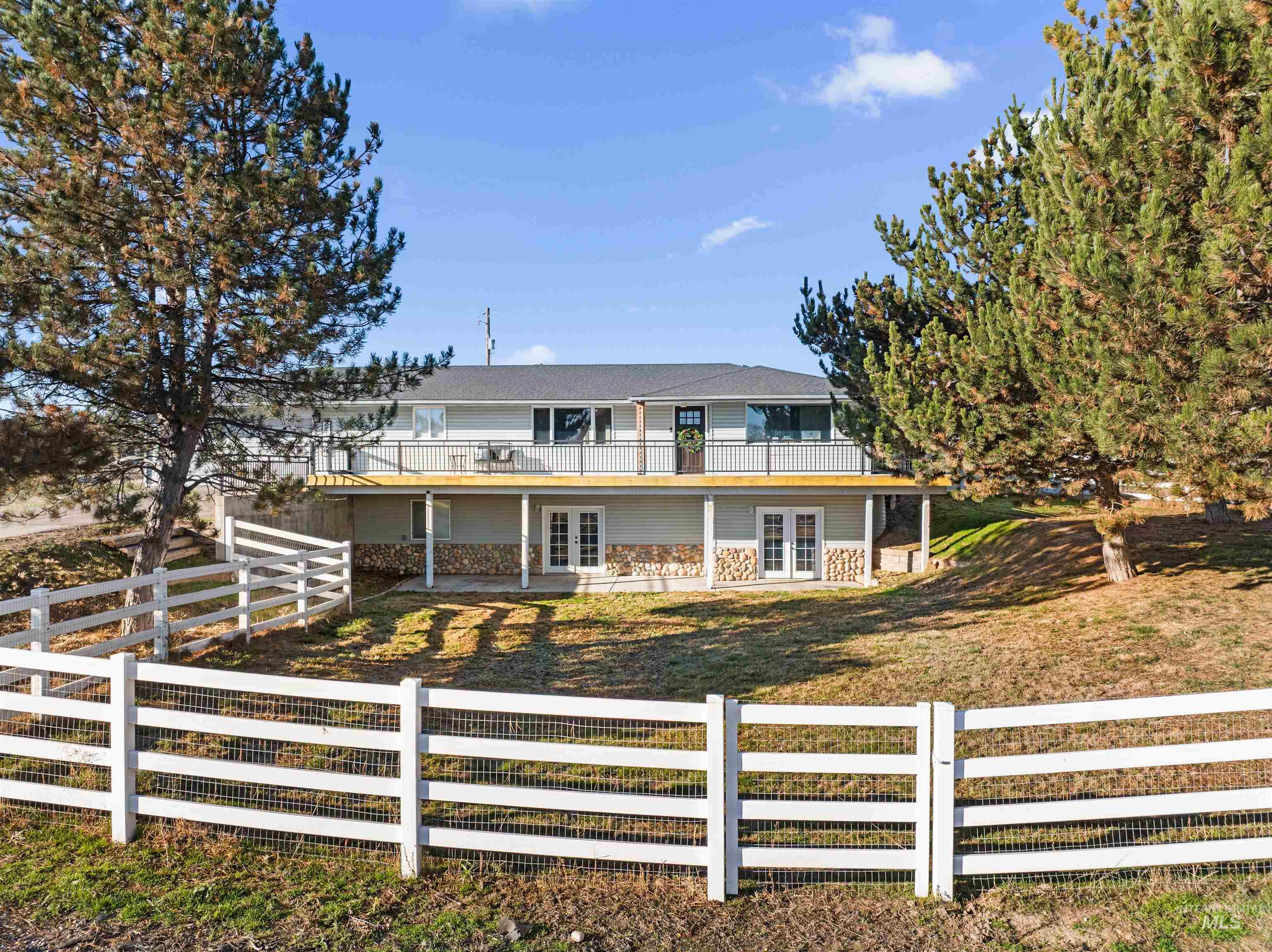 24141 Wanda Way Middleton, ID 83644 - Photo 1 of 20 View of front of house featuring french doors, a fenced backyard, and a patio area