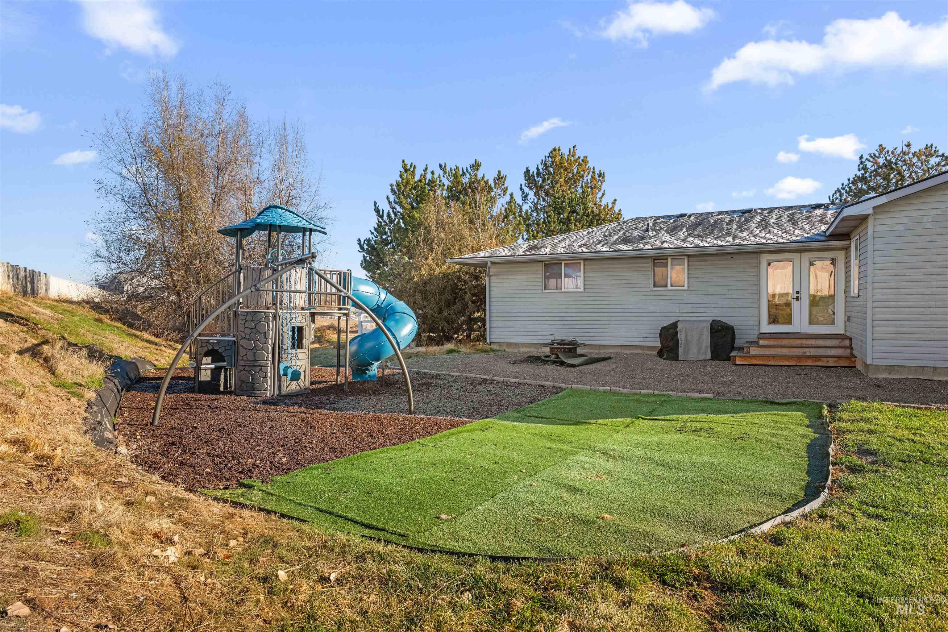 24141 Wanda Way Middleton, ID 83644 - Photo 11 of 20 View of jungle gym with french doors, a lawn, and entry steps