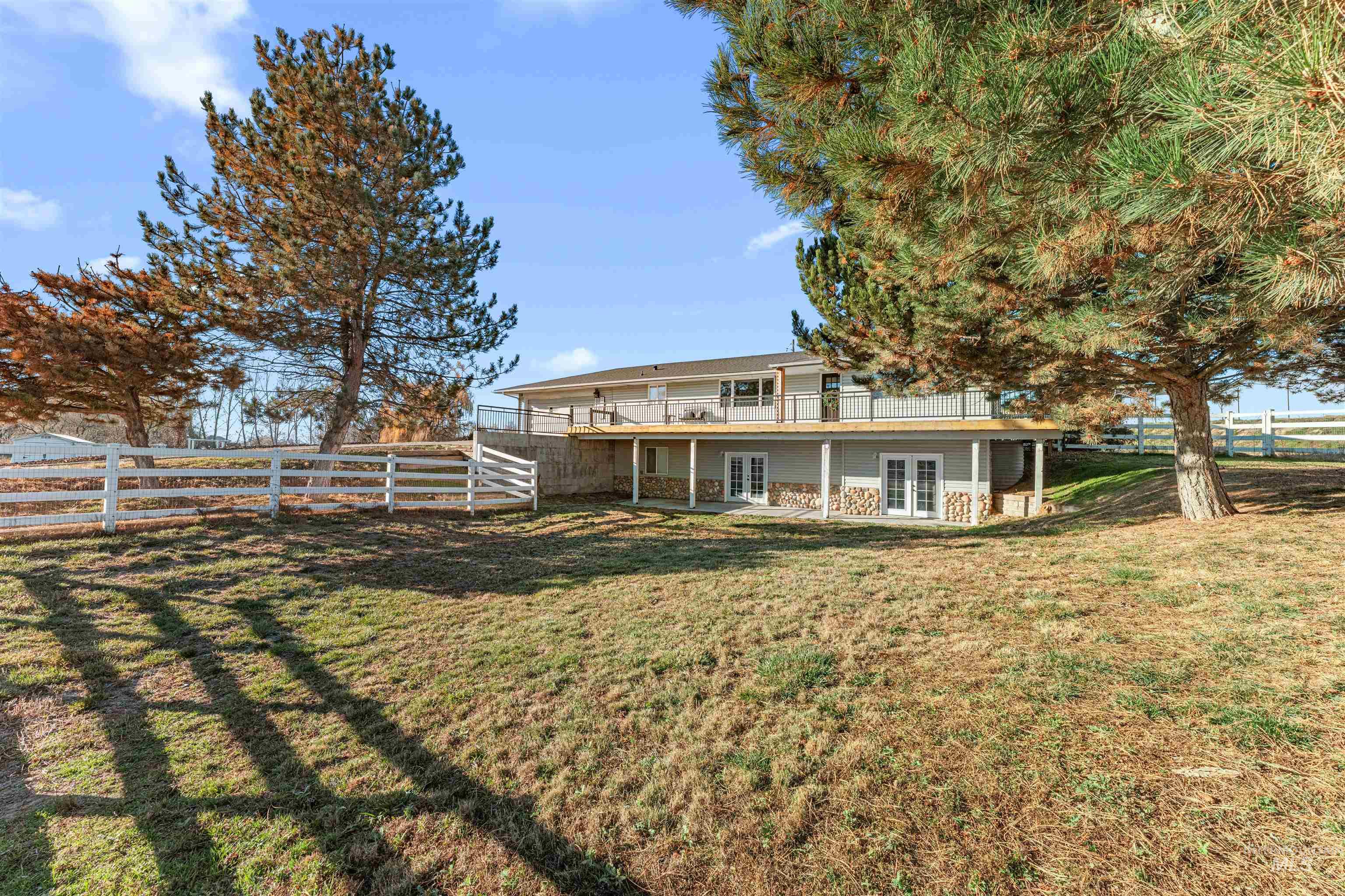 24141 Wanda Way Middleton, ID 83644 - Photo 2 of 20 Back of property featuring french doors, a patio, and a fenced backyard
