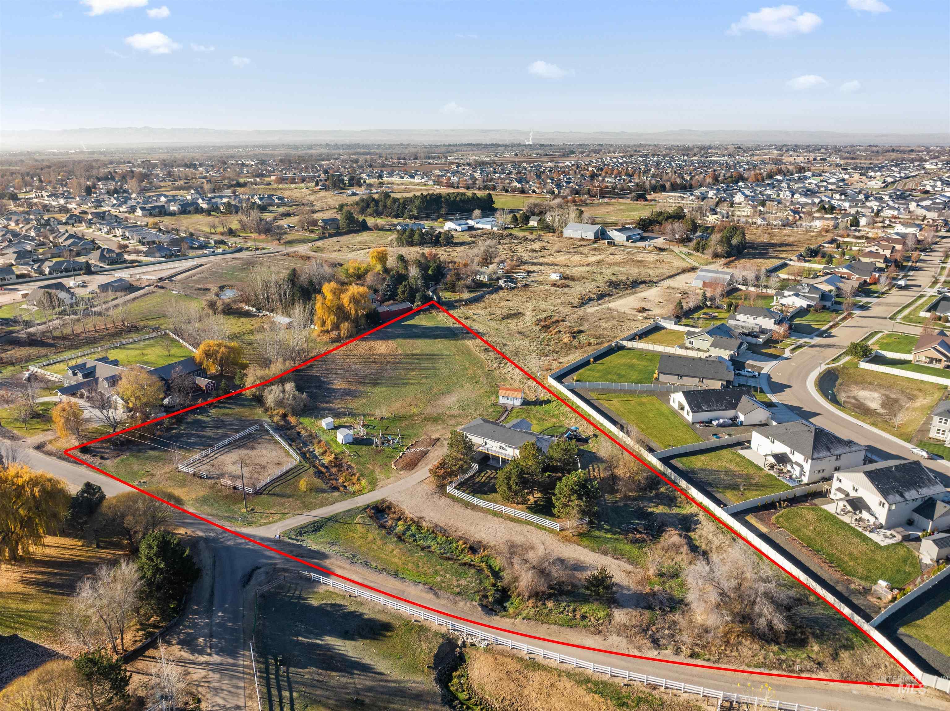 24141 Wanda Way Middleton, ID 83644 - Photo 5 of 20 Aerial view of residential area with property parcel outlined