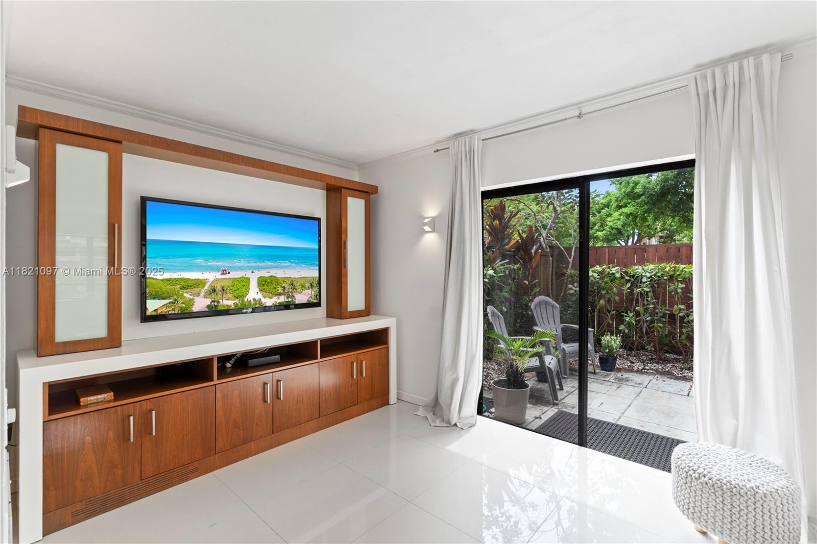 7074 Southwest 114th Place, Unit H Miami, FL 33173 - Photo 7 of 38 a living room with a large window